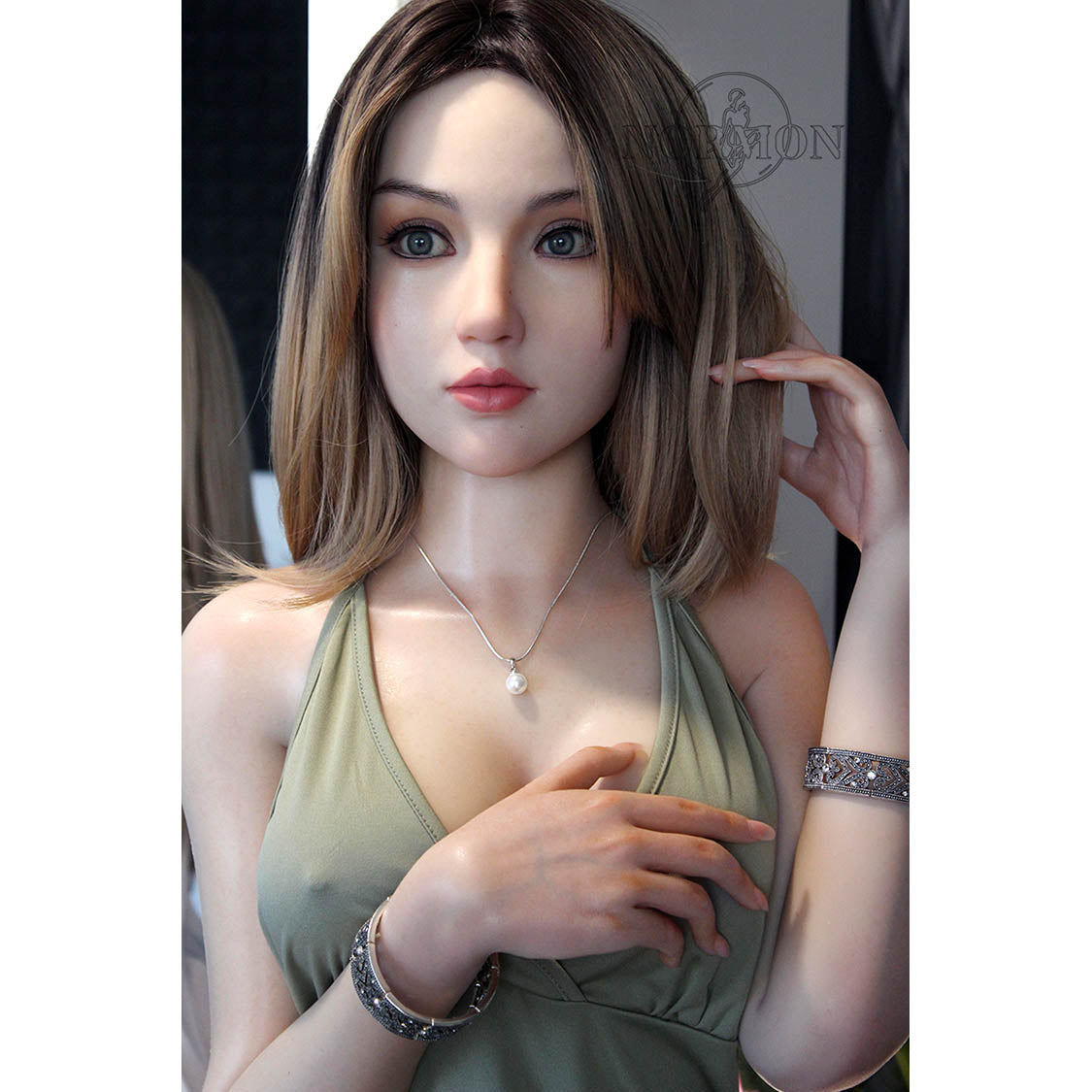 Bess is a 5ft 5in or 165cm tall life size, lifelike, white female silicone sex doll with long legs, blue eyes, straight blonde hair, very light skin, large perky breasts and a very slim athletic body.