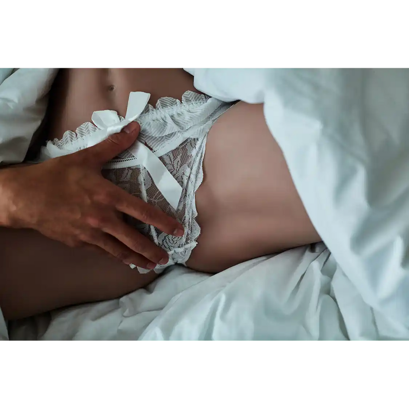 TPE sex doll butt with spread thighs with fair skin.