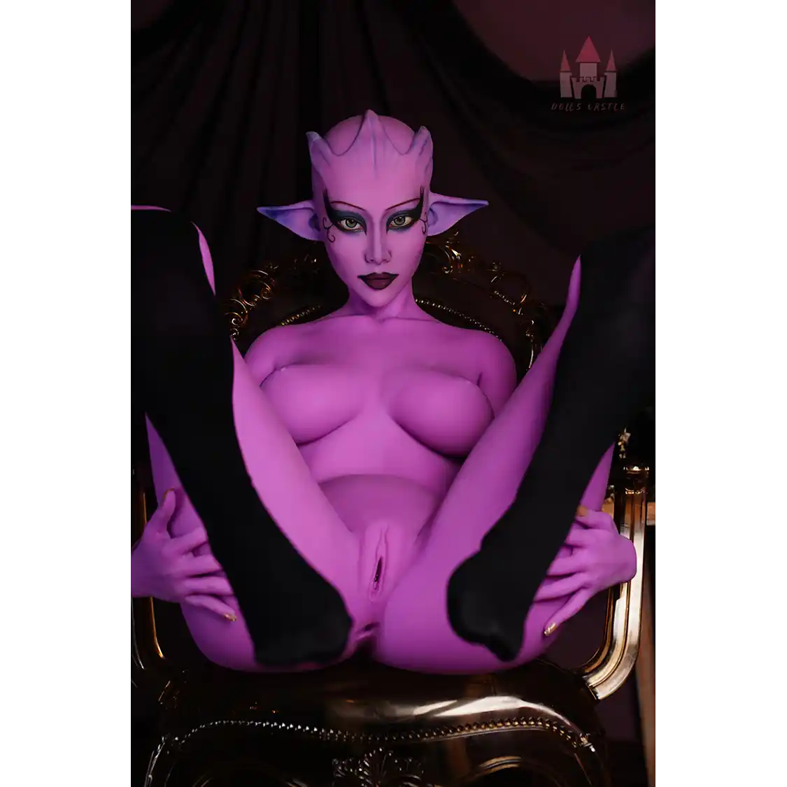 5ft 7in 170cm tall purple alien TPE sex doll with large E-cup breasts, blue eyes and large ears in a black sci-fi outfit.