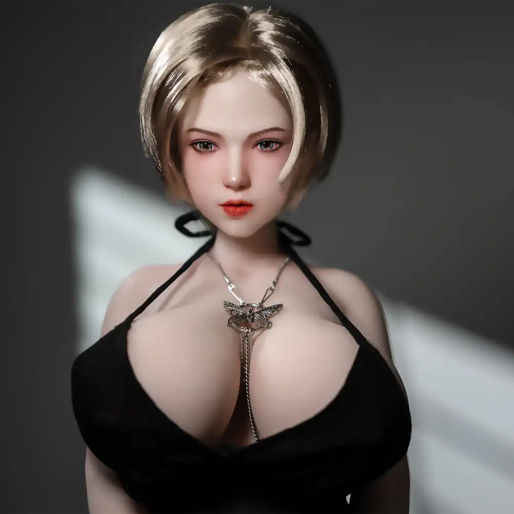 1ft 11in 60cm white female mini sex doll with blonde hair, light skin and extra large breasts.