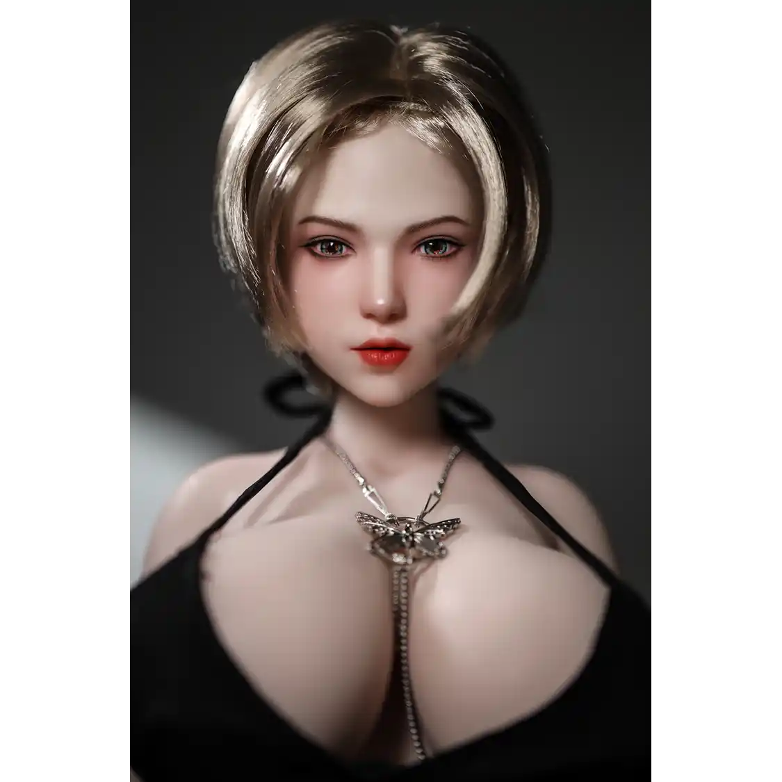 1ft 11in 60cm white female mini sex doll with blonde hair, light skin and extra large breasts.