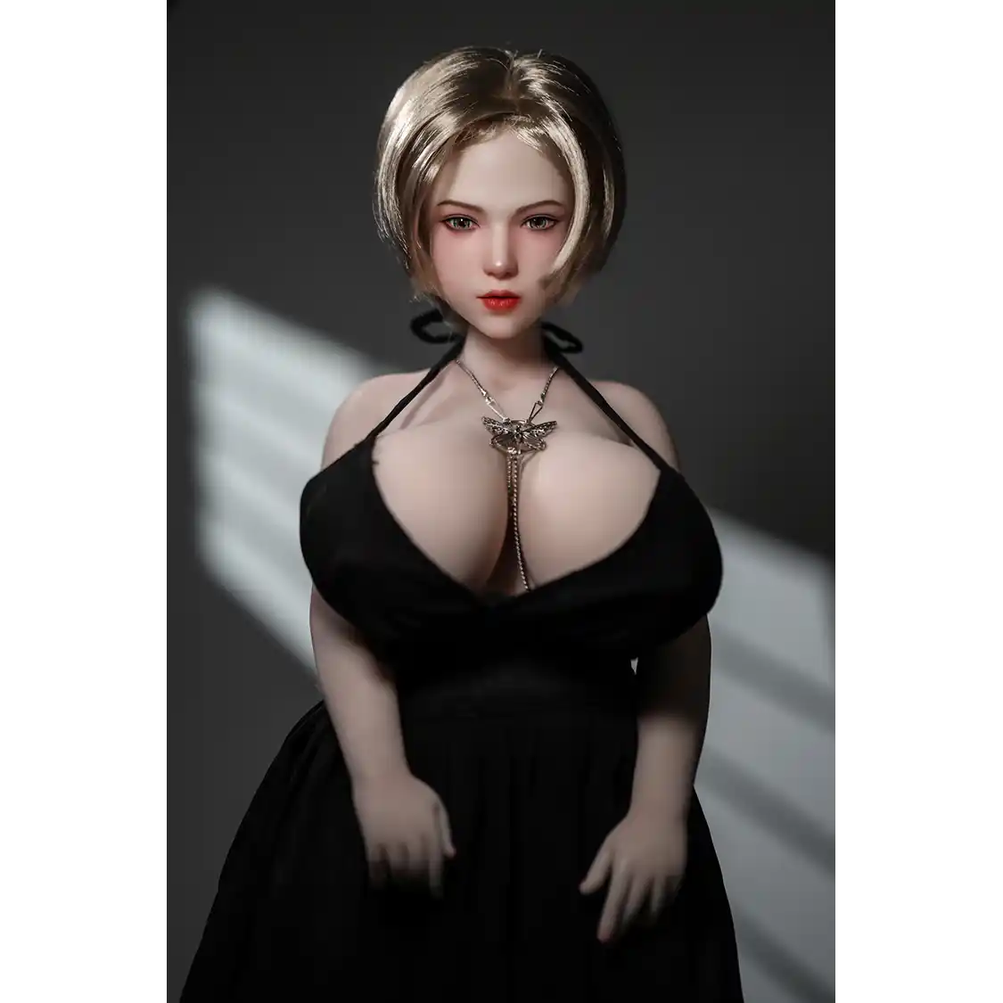 1ft 11in 60cm white female mini sex doll with blonde hair, light skin and extra large breasts.