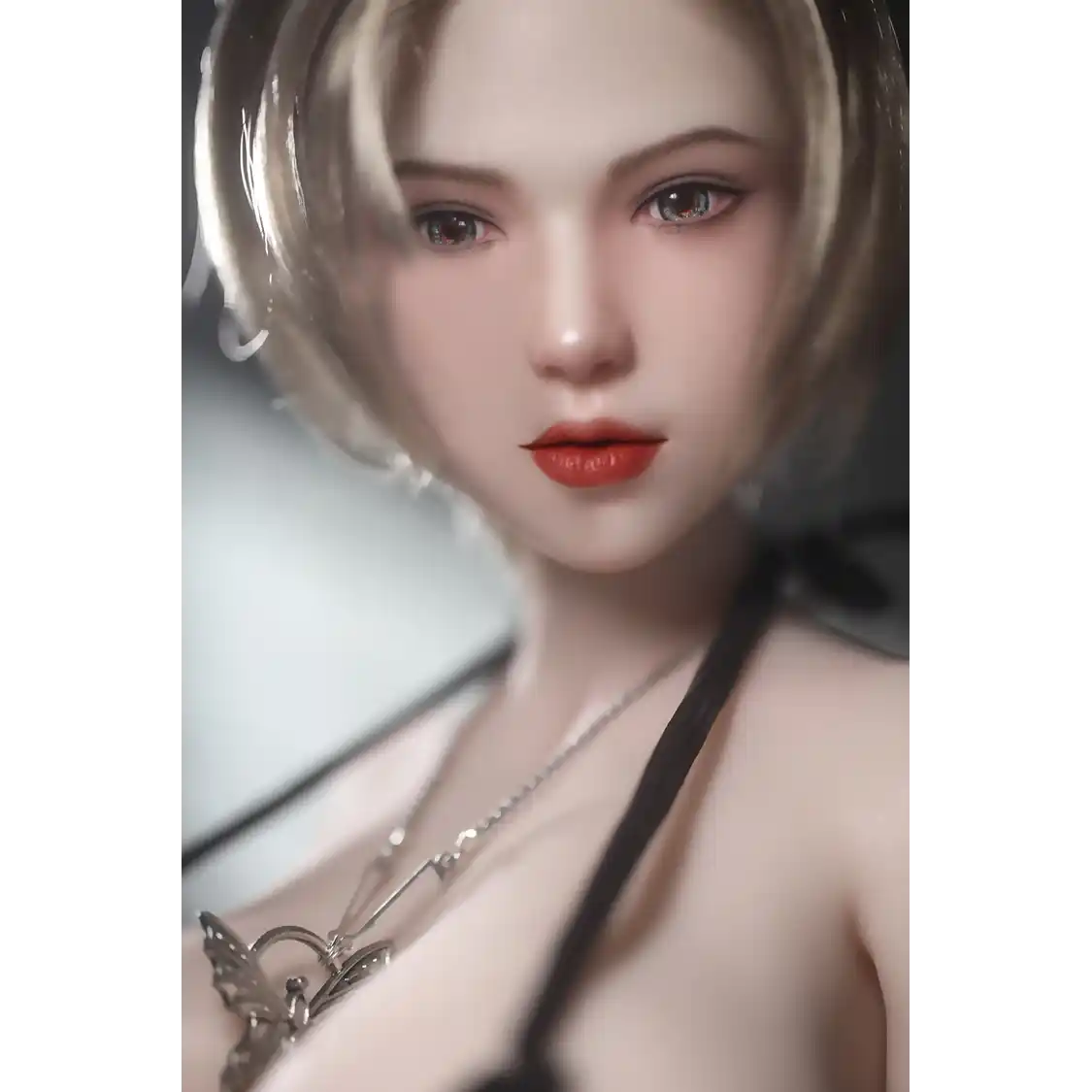 1ft 11in 60cm white female mini silicone sex doll with blonde hair, light skin and extra large breasts.