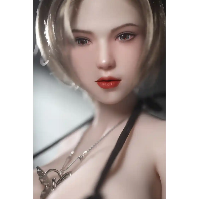 1ft 11in 60cm white female mini silicone sex doll with blonde hair, light skin and extra large breasts.
