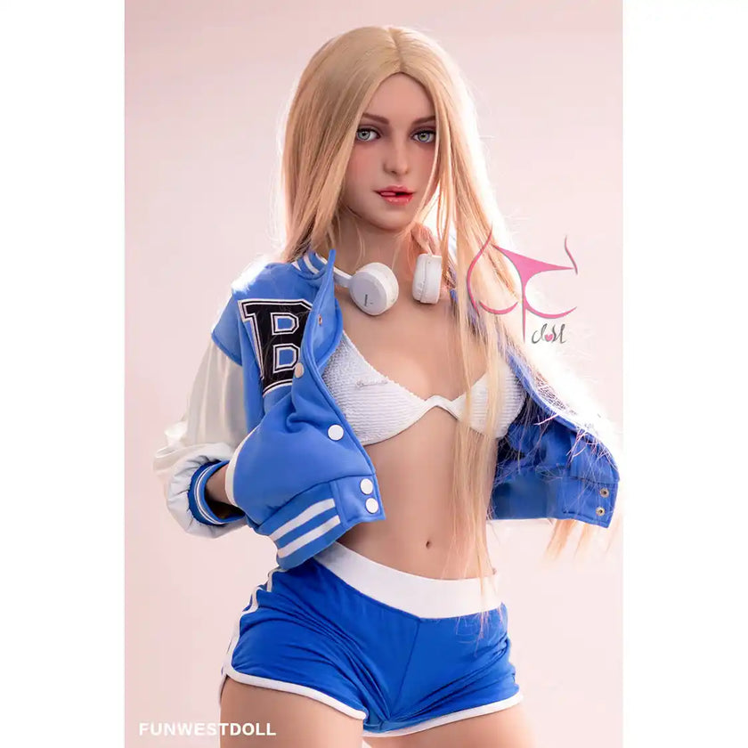 5ft 2in 159cm Caucasian female TPE sex doll by FunWest with blonde hair, small A-cup breasts and a slim athletic figure in small blue shorts and a letterman jacket.