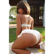 5ft 5in or 164cm curvy Asian hybrid sex doll with long legs, dark hair, large breasts, large butt, and brown eyes in white skirt and bikini top.