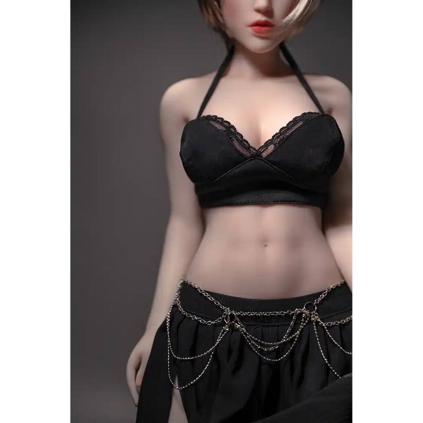 1ft 11in 60cm white female mini silicone sex doll with blonde hair, light skin and large breasts.