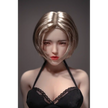 1ft 11in 60cm white female mini silicone sex doll with blonde hair, light skin and large breasts.