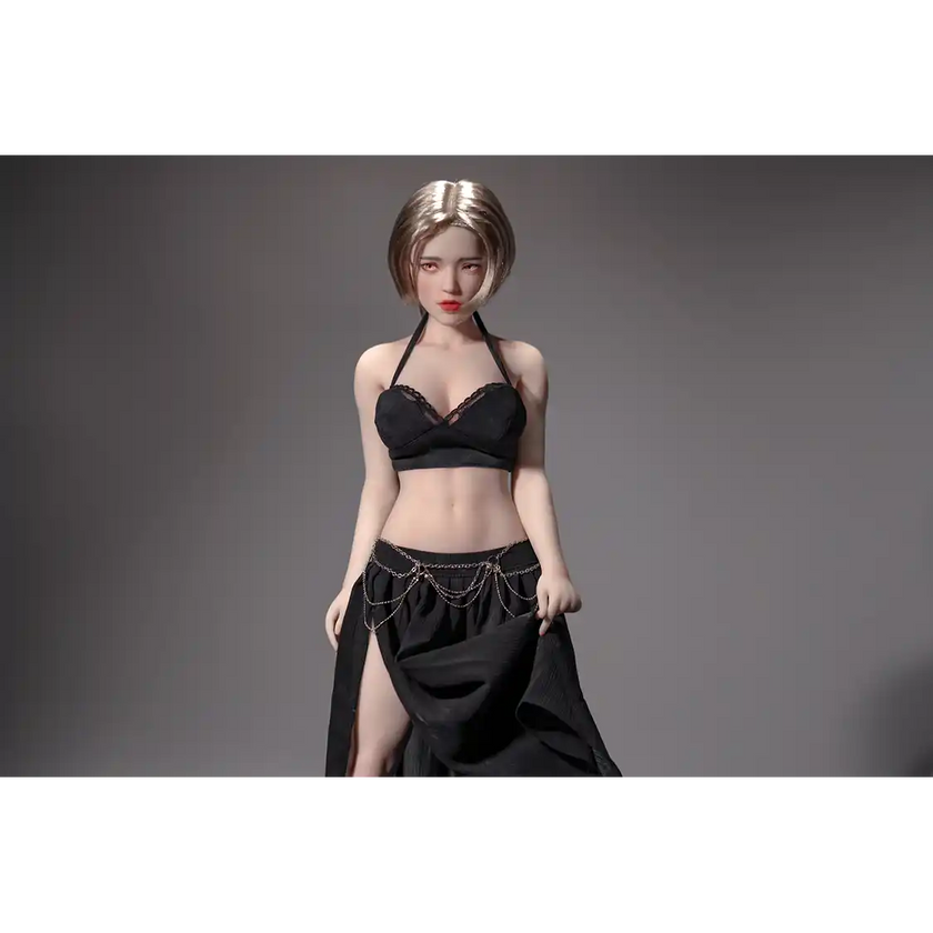 1ft 11in 60cm white female mini silicone sex doll with blonde hair, light skin and large breasts.