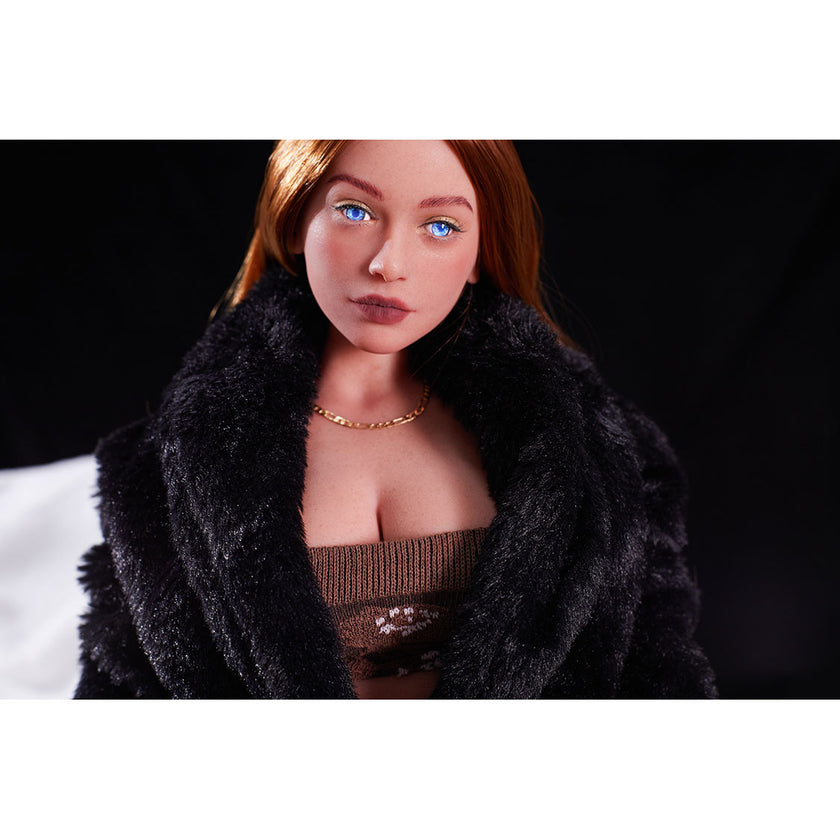 2ft 60cm mini anime sex doll Hedy. Silicone body construction, ultra realistic breasts, and body, fair skin, long red hair and a curvy body in a sheer top, black fur  coat, brown mini skirt and brown tube top.