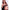 2ft 60cm mini anime sex doll Hedy. Silicone body construction, ultra realistic breasts, and body, fair skin, long red hair and a curvy body in a sheer top, black fur  coat, brown mini skirt and brown tube top.