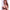 2ft 60cm mini anime sex doll Hedy. Silicone body construction, ultra realistic breasts, and body, fair skin, long red hair and a curvy body in a sheer top, black fur  coat, brown mini skirt and brown tube top.