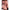 2ft 60cm mini anime sex doll Hedy. Silicone body construction, ultra realistic breasts, and body, fair skin, long red hair and a curvy body in a sheer top, black fur  coat, brown mini skirt and brown tube top.