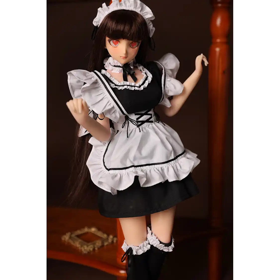 2ft 60cm anime style female mini silicone sex doll with medium breasts, tanned skin and a fit athletic body in a French maids outfit.