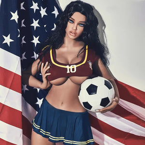 5ft 4in 163cm curvy athletic TPE sex doll with G cup breasts in a soccer outfit with long wavy black hair.