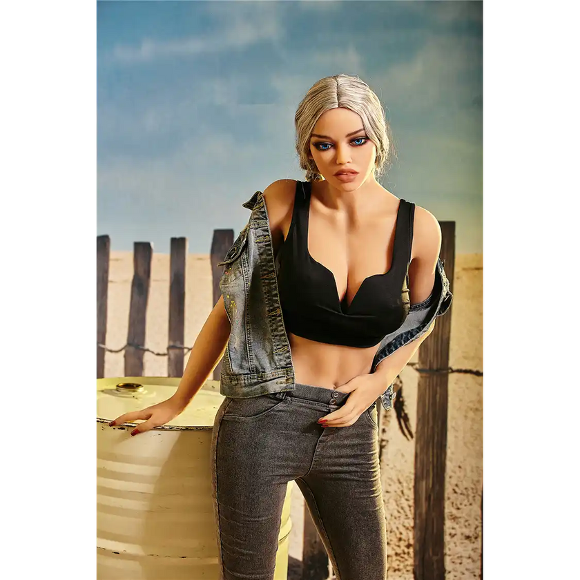 5ft 3in 159cm curvy black TPE sex doll with long braided blonde hair, large E cup breasts and blue eyes in a western outfit.