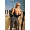 5ft 3in 159cm curvy black TPE sex doll with long braided blonde hair, large E cup breasts and blue eyes in a western outfit.