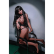 5ft 2in 158cm white female tpe sex doll with long straight black hair, large breasts, and a slim curvy figure in black bondage gear.