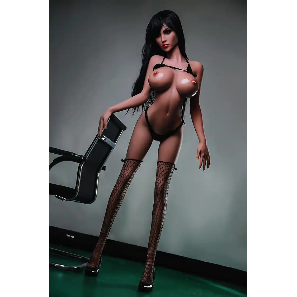 5ft 2in 158cm white female tpe sex doll with long straight black hair, large breasts, and a slim curvy figure in black bondage gear.