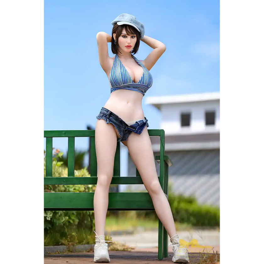 5ft 4in or 163cm curvy hybrid MILF sex doll with long legs, long brown hair, large breasts, large butt, and blue eyes in small top and very short denim shorts.
