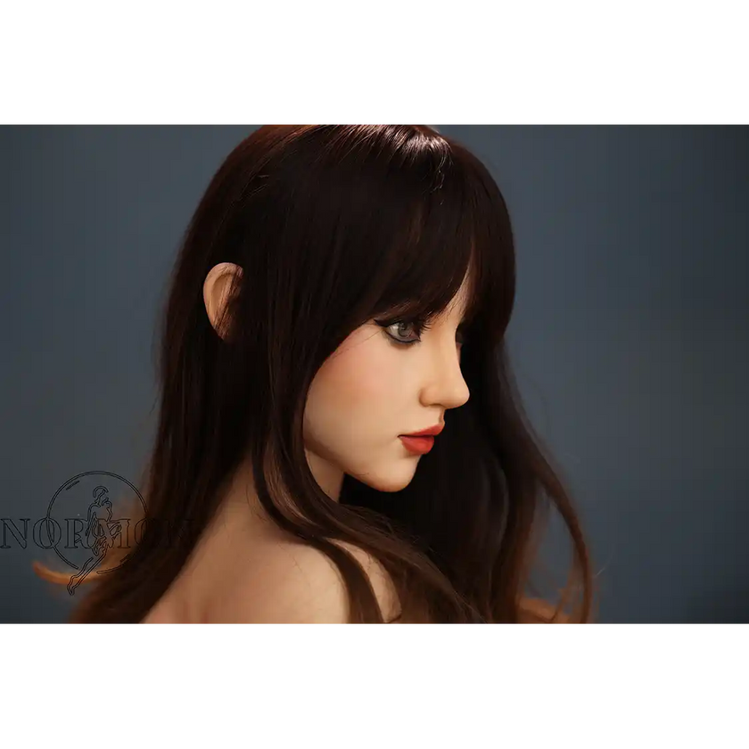 5ft 4in or 163cm tall life size silicone sex doll with long legs and long brown hair in jeans and a black top.