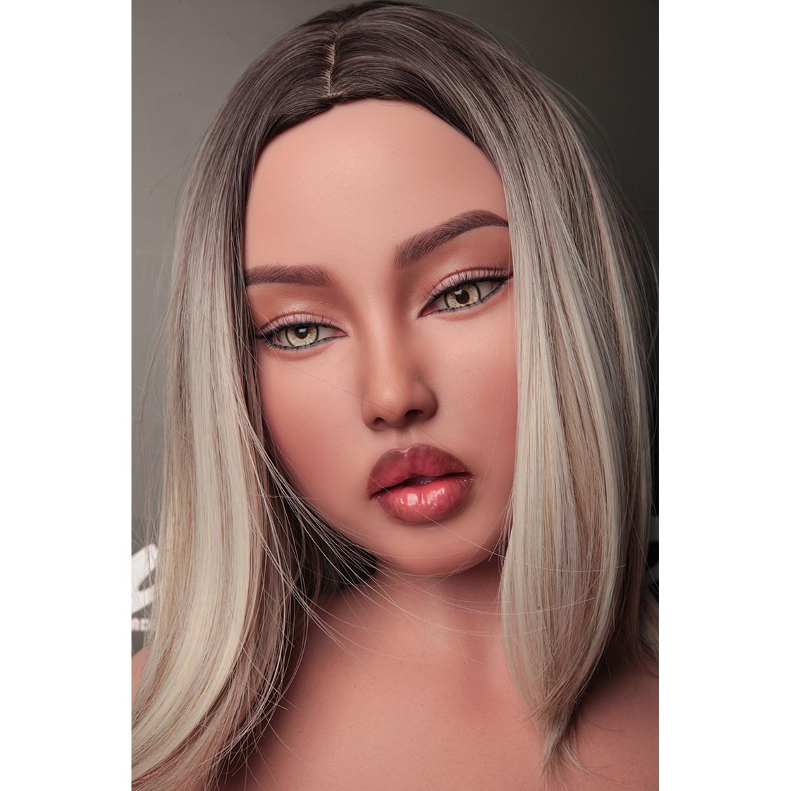 5ft 3in or 159cm silicone MILF sex doll with blonde hair, light skin, chubby figure, large breasts and hazel eyes with extremely lifelike body.  Made by Climax Doll.