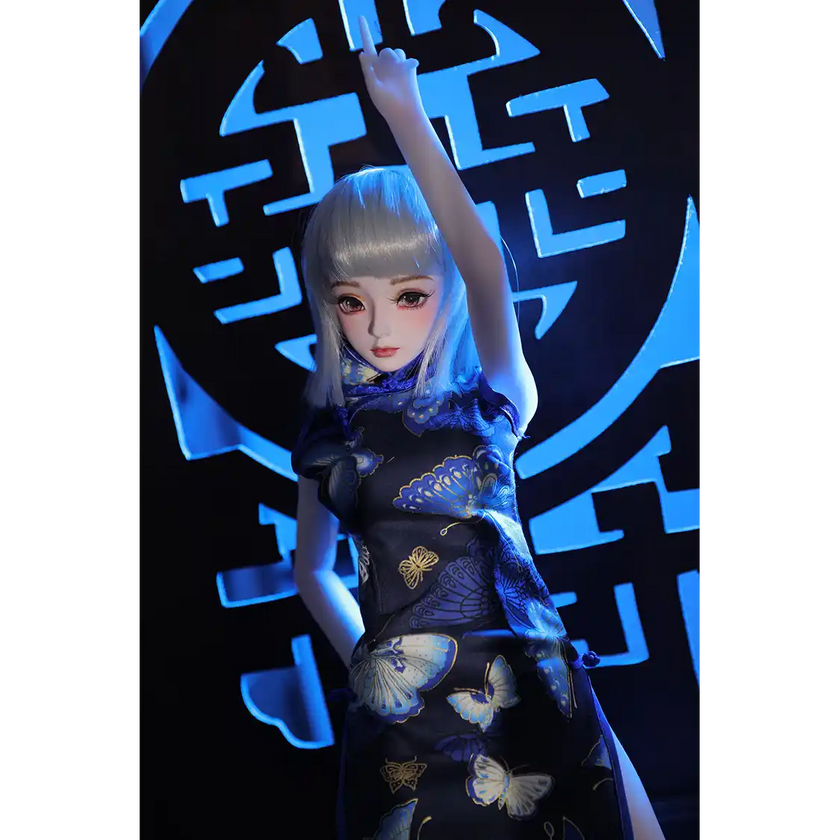 2ft 60cm anime style female mini silicone sex doll with medium breasts, light skin and a fit athletic body in a chinese dress.