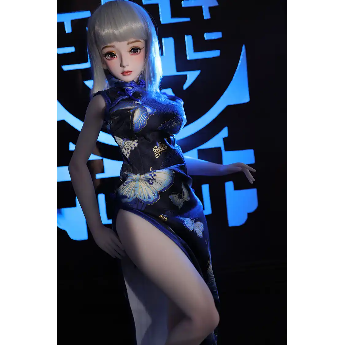 2ft 60cm anime style female mini silicone sex doll with medium breasts, light skin and a fit athletic body in a chinese dress.