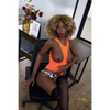 5ft 9in 175cm athletic black TPE sex doll with long legs, curly blondeish hair, large breasts and brown eyes in a tight orange dress.