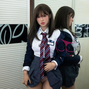 5ft 4in 165cm Asian female TPE sex doll with brown hair, C-cup breasts and a slim athletic figure in school girl outfit.