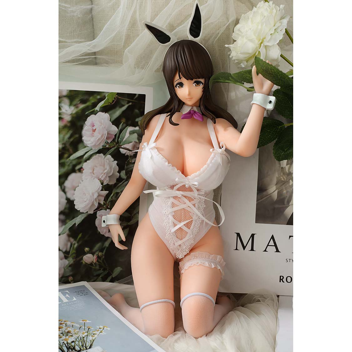 1ft 06in 45cm anime style mini silicone sex doll with black hair, light skin and large breasts.