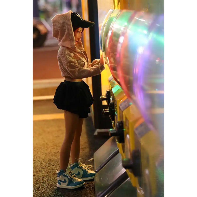 1ft 11in 60cm anime style female mini silicone sex doll with red hair, light skin and large breasts.