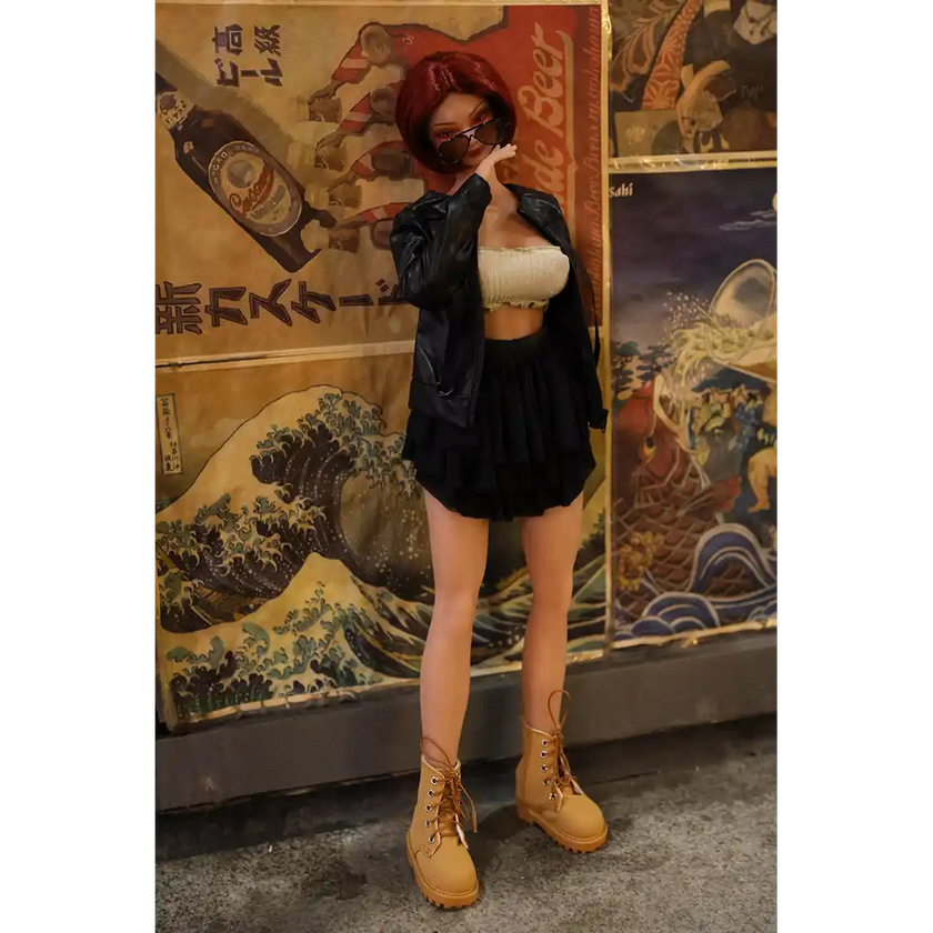 1ft 11in 60cm anime style female mini silicone sex doll with red hair, light skin and large breasts.