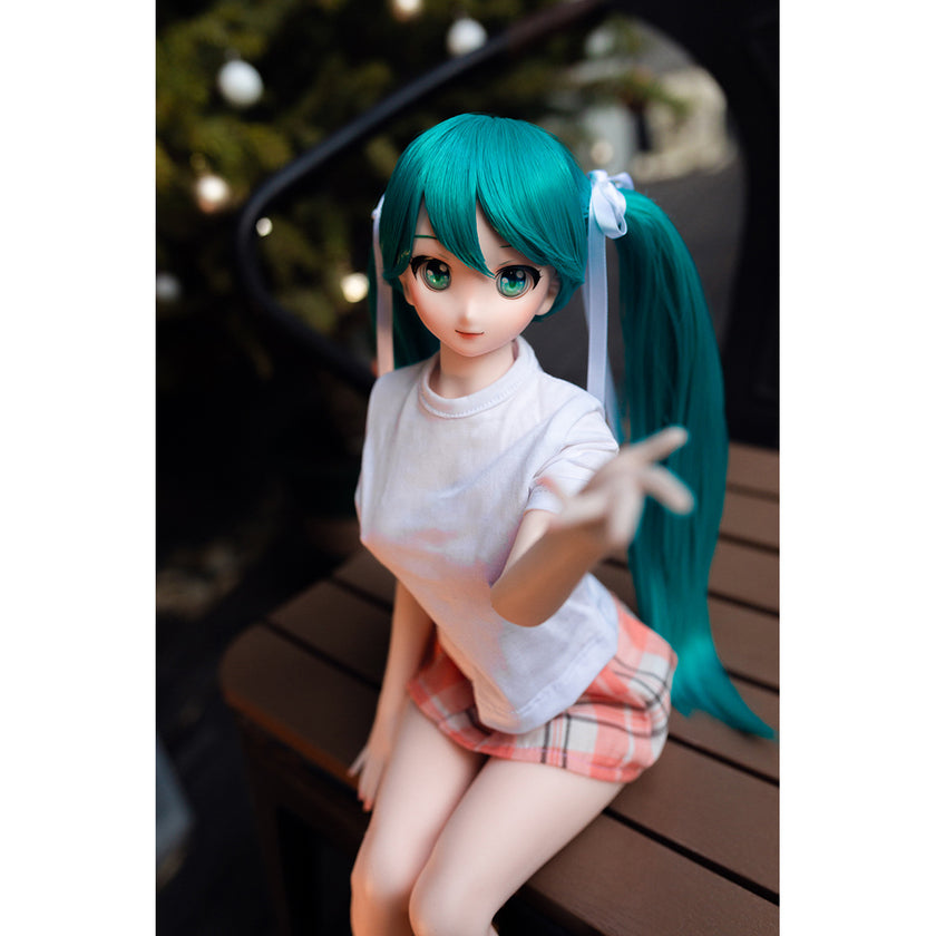 2ft 60cm mini anime sex doll Kurumi. Made of silicone featuring large breasts, fair skin, long blue hair and a fit athletic body in a skirt and t-shirt.