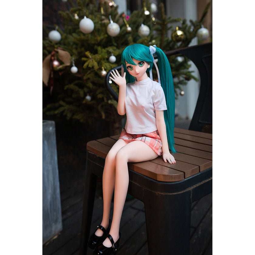 2ft 60cm mini anime sex doll Kurumi. Made of silicone featuring large breasts, fair skin, long blue hair and a fit athletic body in a skirt and t-shirt.