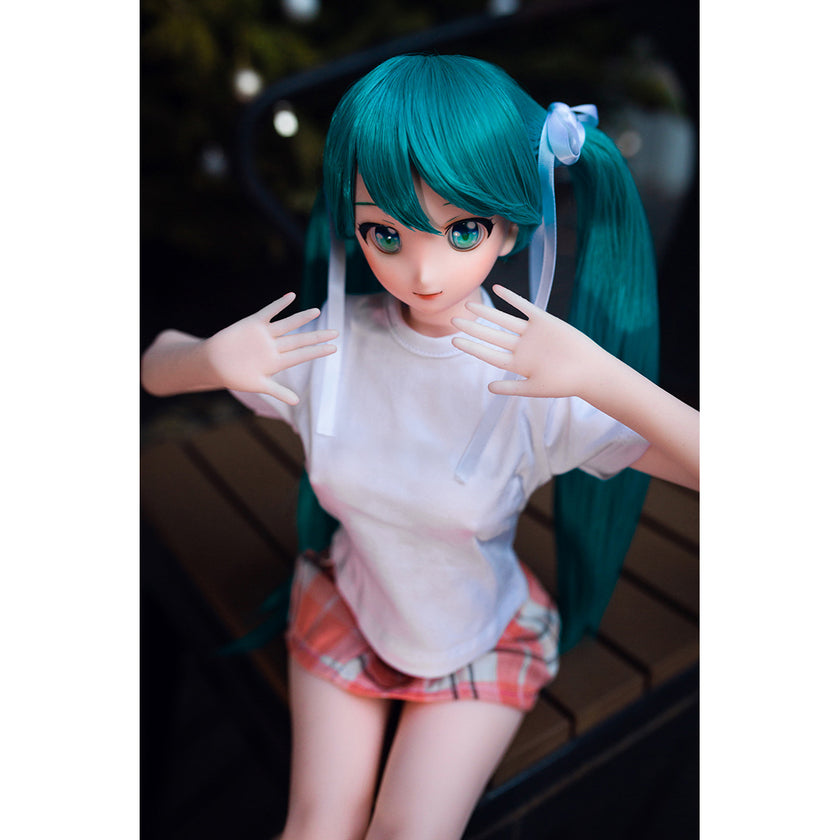 2ft 60cm mini anime sex doll Kurumi. Made of silicone featuring large breasts, fair skin, long blue hair and a fit athletic body in a skirt and t-shirt.