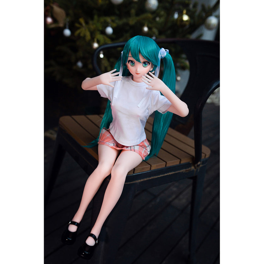 2ft 60cm mini anime sex doll Kurumi. Made of silicone featuring large breasts, fair skin, long blue hair and a fit athletic body in a skirt and t-shirt.