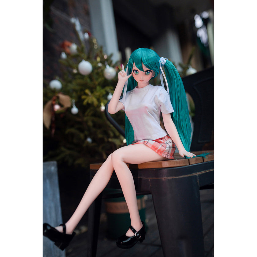 2ft 60cm mini anime sex doll Kurumi. Made of silicone featuring large breasts, fair skin, long blue hair and a fit athletic body in a skirt and t-shirt.