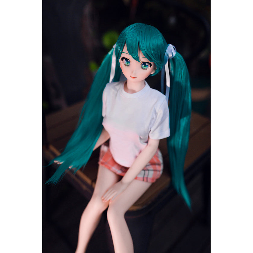 2ft 60cm mini anime sex doll Kurumi. Made of silicone featuring large breasts, fair skin, long blue hair and a fit athletic body in a skirt and t-shirt.
