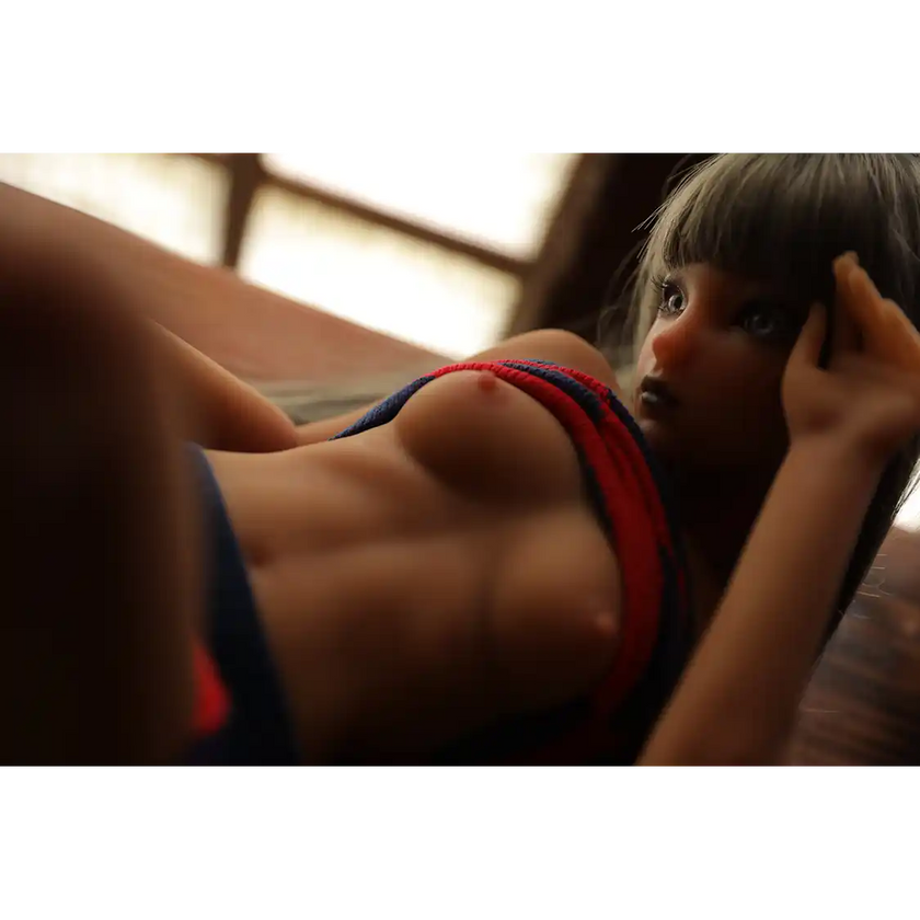 1ft 11in 60cm affordable mini female silicone sex doll with silver hair, blue eyes small breasts and a slim athletic figure.