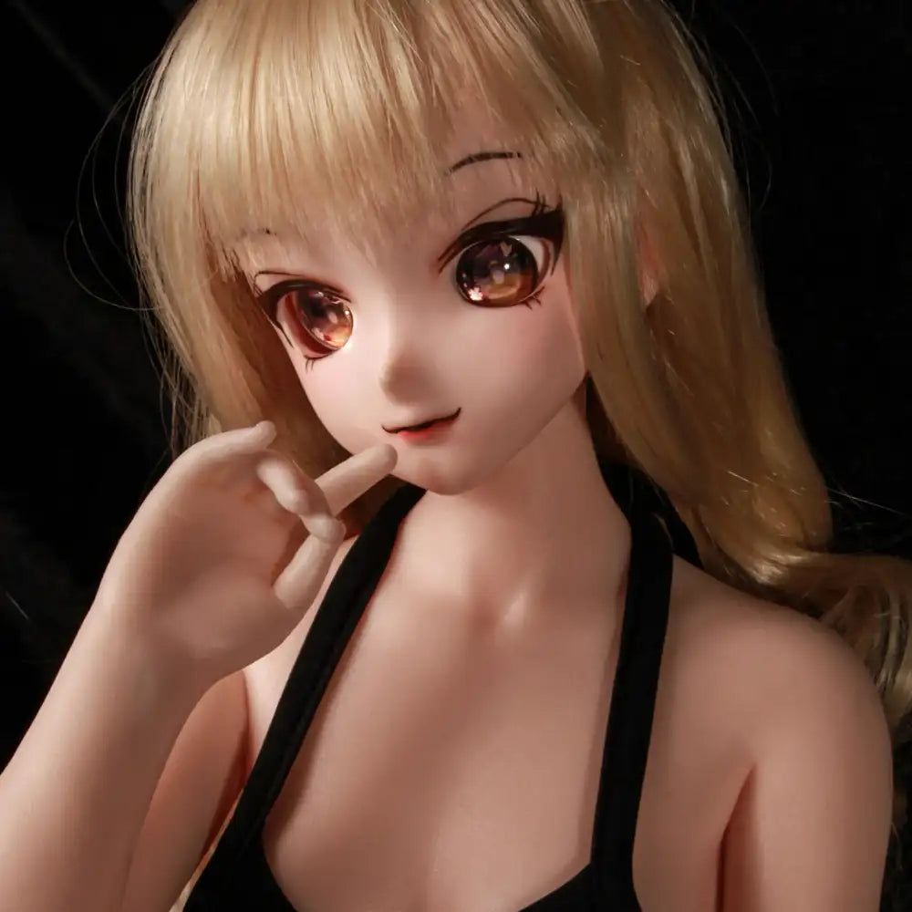 2ft 60cm anime style female mini silicone sex doll with medium breasts, fair skin and a fit athletic body in a black bikini.