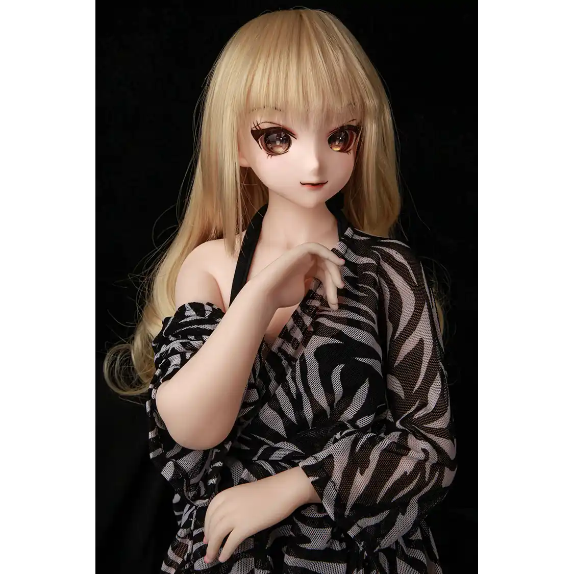 2ft 60cm anime style female mini silicone sex doll with medium breasts, fair skin and a fit athletic body in a black bikini.