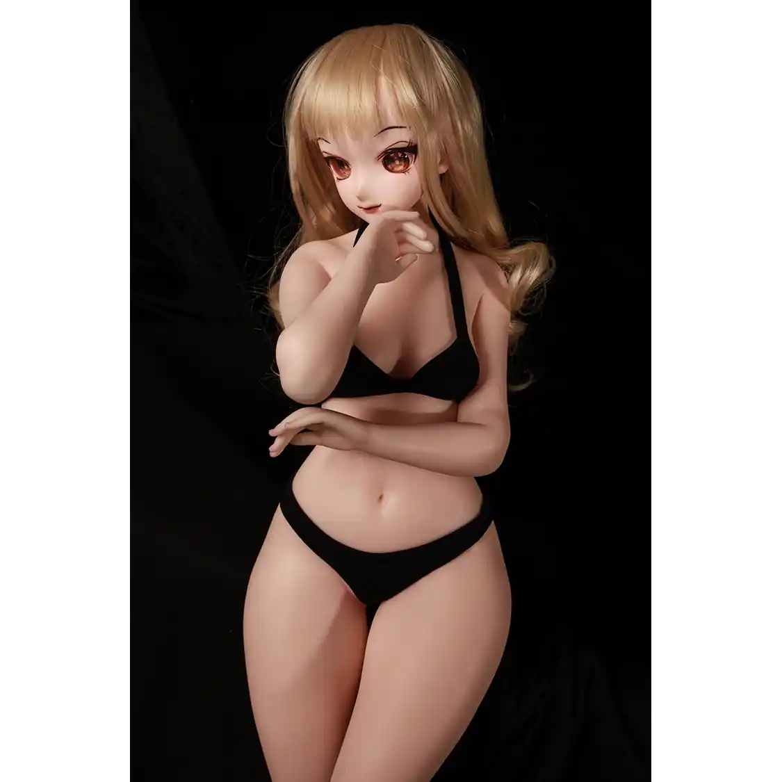 2ft 60cm anime style female mini silicone sex doll with medium breasts, fair skin and a fit athletic body in a black bikini.