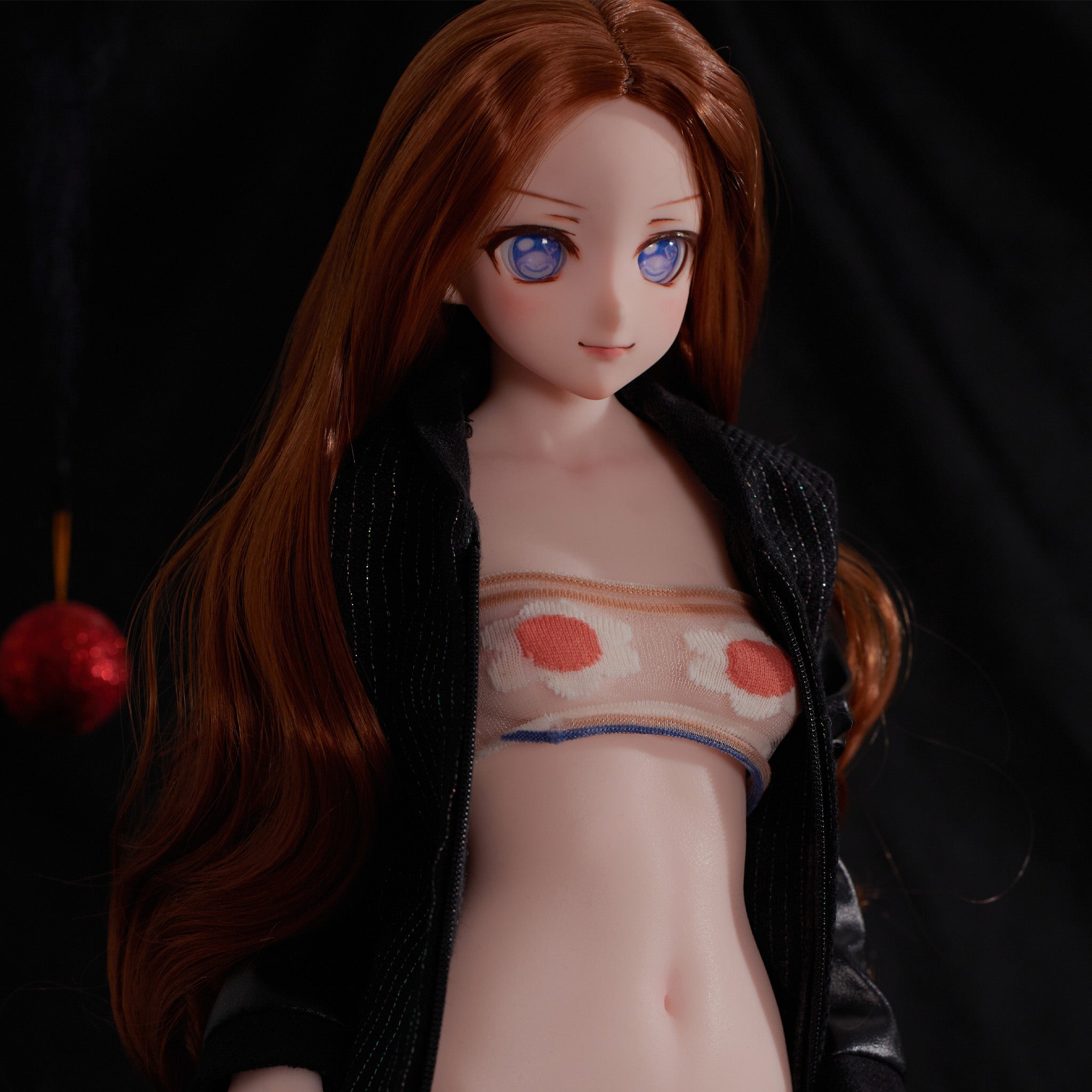 2ft 60cm mini anime sex doll Nanami. Silicone body construction, small breasts, fair skin, short brown hair and a slim sexy body in a  sheer top, black leather coat and tiny shirt and top.  Made by Climax Doll