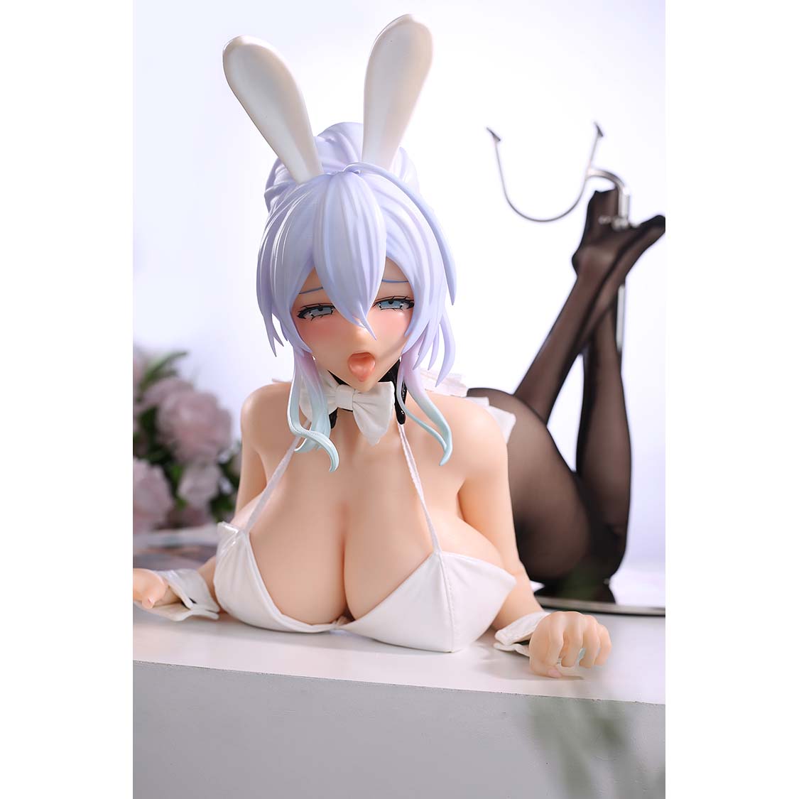 2ft 01in 65cm mini silicone anime sex doll with purple hair, light skin and very large breasts.  Made by AF Doll.