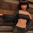 1ft 11in 60cm lifelike mini silicone sex doll with brown hair, slim athletic body and medium breasts.