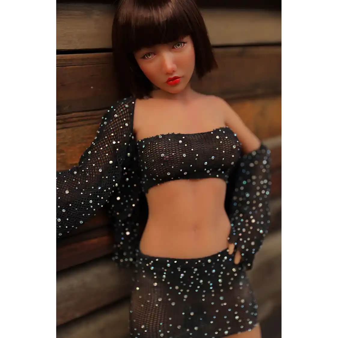 1ft 11in 60cm lifelike mini silicone sex doll with brown hair, slim athletic body and medium breasts.