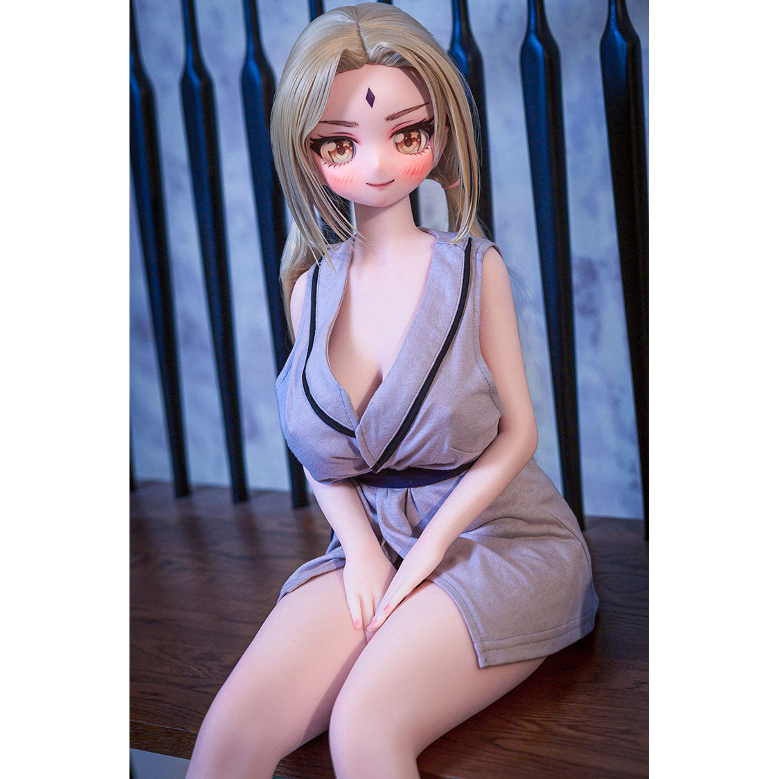 2ft 9in or 85cm tall mini anime sex doll Reyna. Silicone body construction, large breasts, fair skin, jaw length blonde hair and a slim athletic body in a sexy Asian style fantasy outfit.