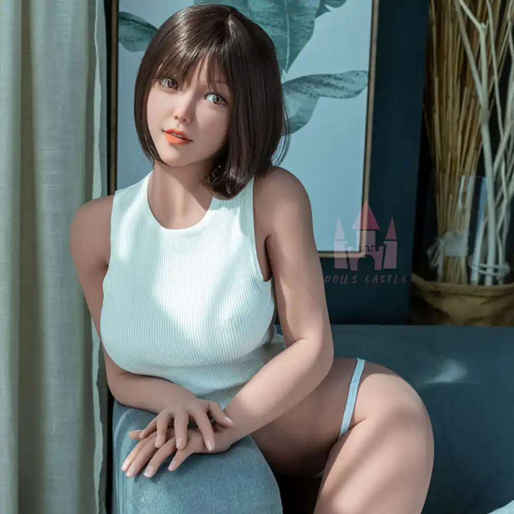 5ft 4in 163cm tall hot Asian TPE sex doll with large E-cup breasts, brown eyes and short dark hair.