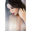 5ft 3in 159cm curvy Asian TPE sex doll with long wavy black hair, fair sking and large E-cup breasts in see through lingerie.